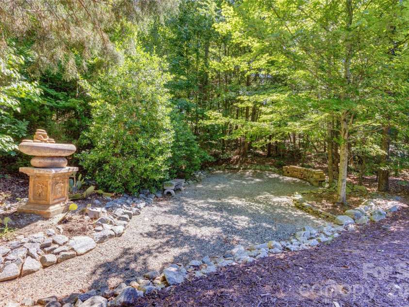 6005 Willowood Road, Kannapolis, NC 28081.  MLS# CAR4389697, YatesRealty ID 28865. Pathways in back of yard