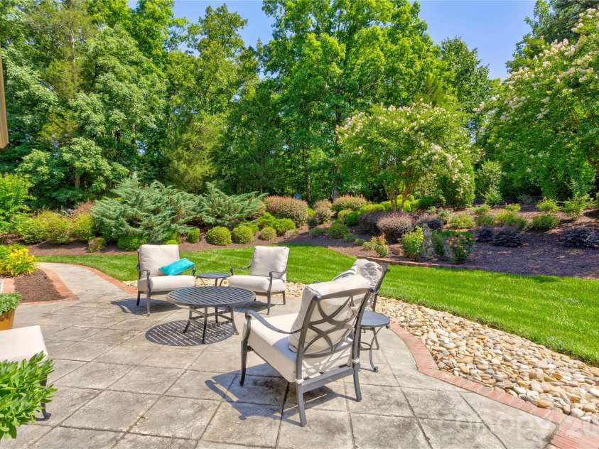 6005 Willowood Road, Kannapolis, NC 28081.  MLS# CAR4389697, YatesRealty ID 28865. Patios just beyond the house