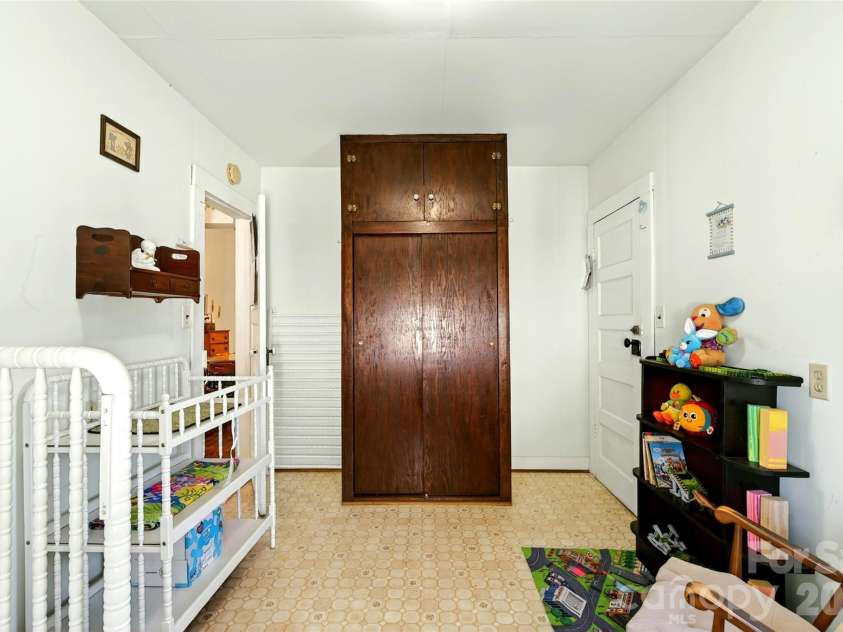 35 Second Street, Marion, NC 28752.  MLS# CAR4376895, YatesRealty ID 28866. A wardrobe is built into the room for storage
