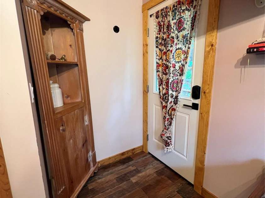 384 Bear Cub Drive, Spruce Pine, NC 28777.  MLS# CAR4389087, YatesRealty ID 28869. Exterior door to small deck in flex space #1
