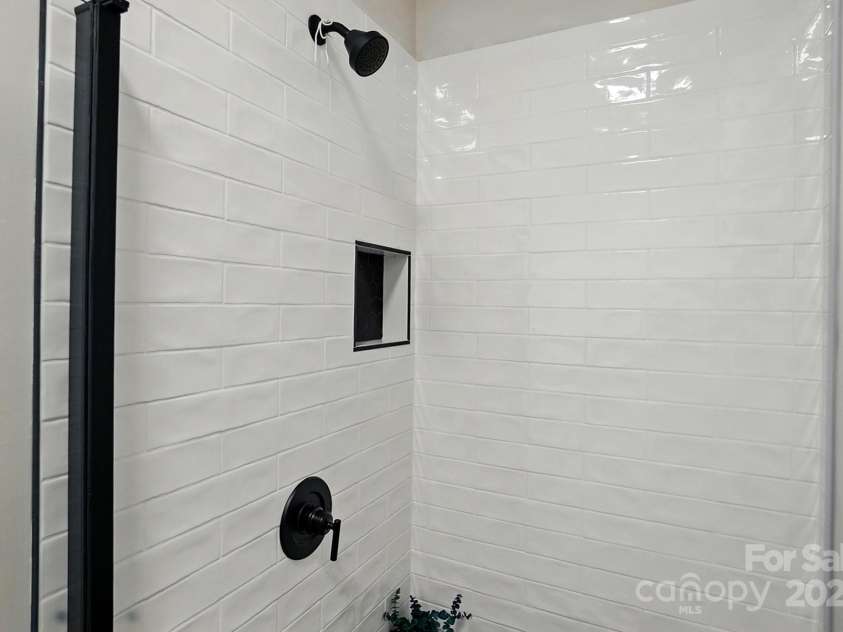 8726 Castle Cliff Drive, Matthews, NC 28105.  MLS# CAR4248763, YatesRealty ID 28871. New glass door and tiled walls