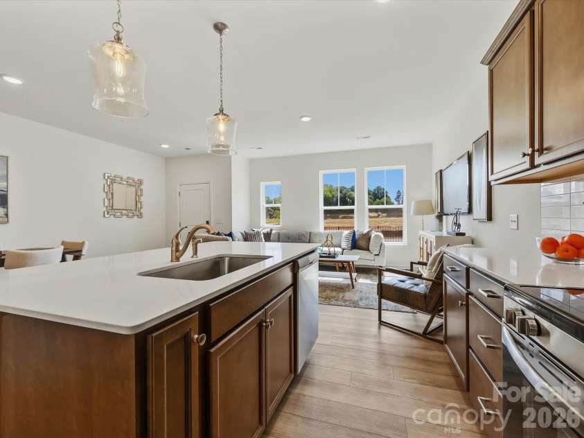 6543 Fire Lily Lane, Charlotte, NC 28216.  MLS# CAR4351859, YatesRealty ID 28876. Kitchen Leading into Living Room and Dining Area Creating a Nice Open Flow