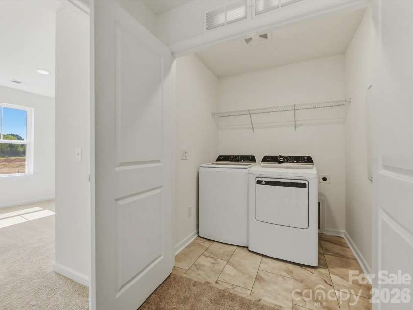 6543 Fire Lily Lane, Charlotte, NC 28216.  MLS# CAR4351859, YatesRealty ID 28876. Laundry Area