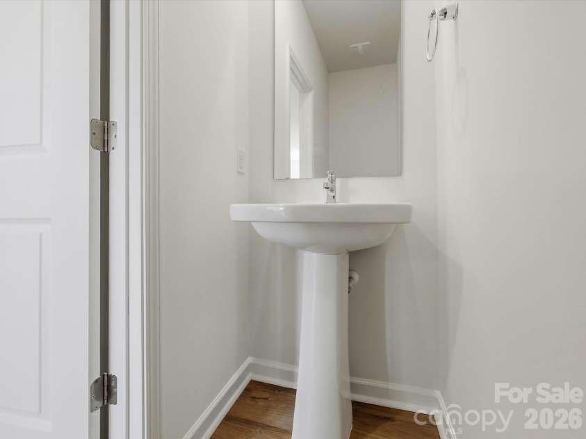 6543 Fire Lily Lane, Charlotte, NC 28216.  MLS# CAR4351859, YatesRealty ID 28876. Powder Bathroom on 1st Floor