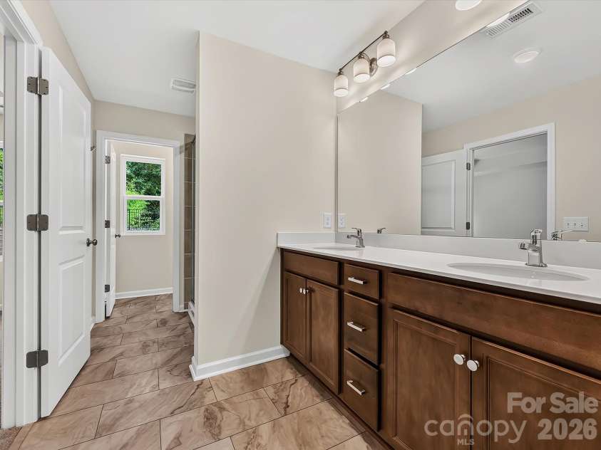 6543 Fire Lily Lane, Charlotte, NC 28216.  MLS# CAR4351859, YatesRealty ID 28876. Spacious Owner's Bathroom with Double Sink Vanity