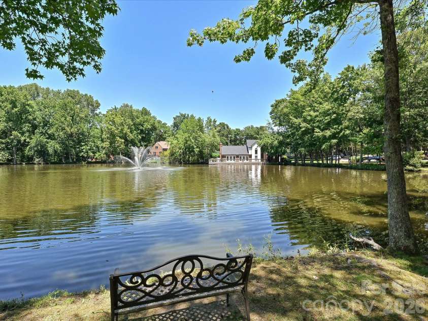 5203 Rustlewood Lane, Charlotte, NC 28226.  MLS# CAR4390578, YatesRealty ID 28877. Pond directly across from home and view of clubhouse