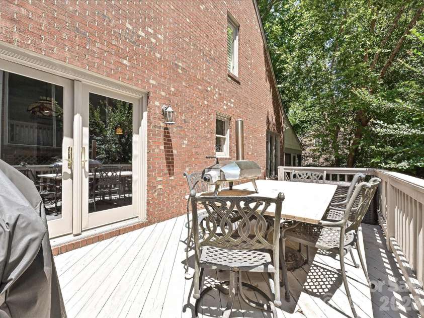5203 Rustlewood Lane, Charlotte, NC 28226.  MLS# CAR4390578, YatesRealty ID 28877. Side patio grilling area