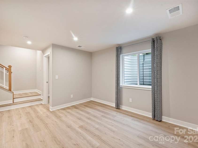 342 Cramerton Mills Parkway, Cramerton, NC 28032.  MLS# CAR4279503, YatesRealty ID 28898. Basement Den with Two Storage Closets