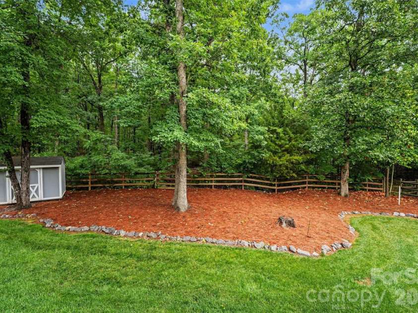 1320 Mill Race Lane, Matthews, NC 28104.  MLS# CAR4384297, YatesRealty ID 28900. Backyard