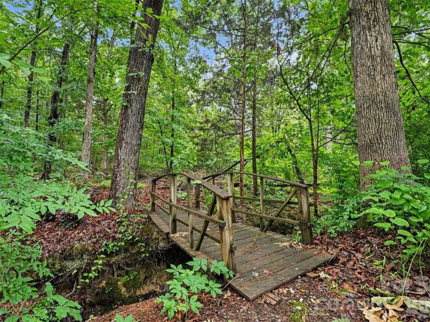 1320 Mill Race Lane, Matthews, NC 28104.  MLS# CAR4384297, YatesRealty ID 28900. Backyard trail
