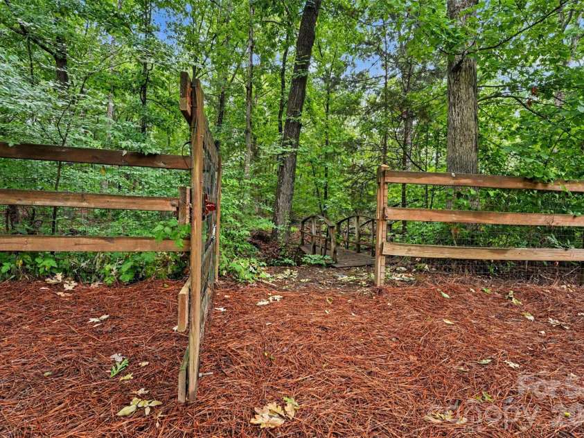 1320 Mill Race Lane, Matthews, NC 28104.  MLS# CAR4384297, YatesRealty ID 28900. Gate access to backyard trail