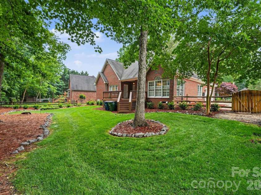 1320 Mill Race Lane, Matthews, NC 28104.  MLS# CAR4384297, YatesRealty ID 28900. Lush backyard