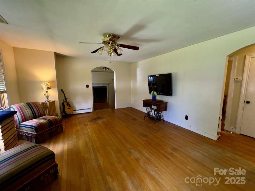 169 Montview Circle, Brevard, NC 28712.  MLS# CAR4276935, YatesRealty ID 28907. Livingroom to den