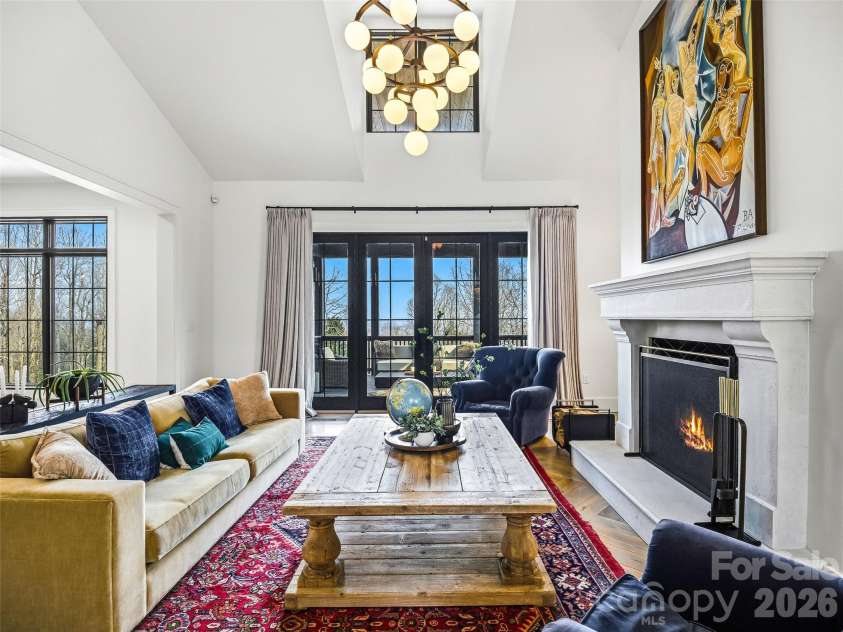 241 Tower Circle, Laurel Park, NC 28739.  MLS# CAR4346762, YatesRealty ID 2892. Bright living space with fireplace, hardwood floors, and elevated architectural details