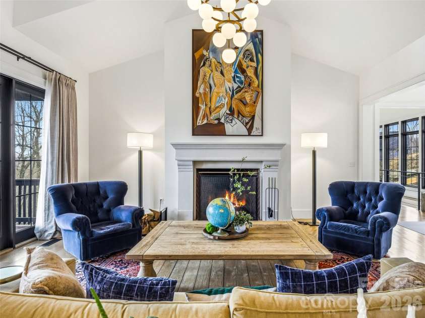 241 Tower Circle, Laurel Park, NC 28739.  MLS# CAR4346762, YatesRealty ID 2892. Great room with vaulted ceilings, statement chandelier, and fireplace centerpiece