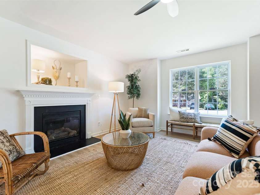 5229 Tarrywood Lane, Charlotte, NC 28205.  MLS# CAR4268771, YatesRealty ID 28922. Cozy living room with gas fireplace.