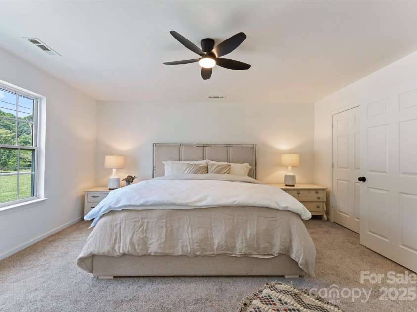 5229 Tarrywood Lane, Charlotte, NC 28205.  MLS# CAR4268771, YatesRealty ID 28922. Large bedroom on main level with walk-in closet.