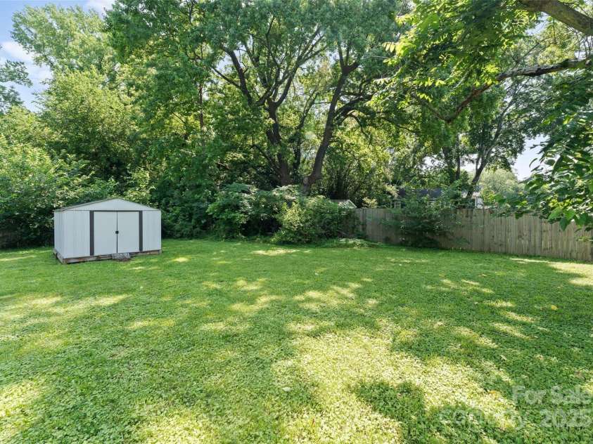 5229 Tarrywood Lane, Charlotte, NC 28205.  MLS# CAR4268771, YatesRealty ID 28922. Spacious backyard with a shed.