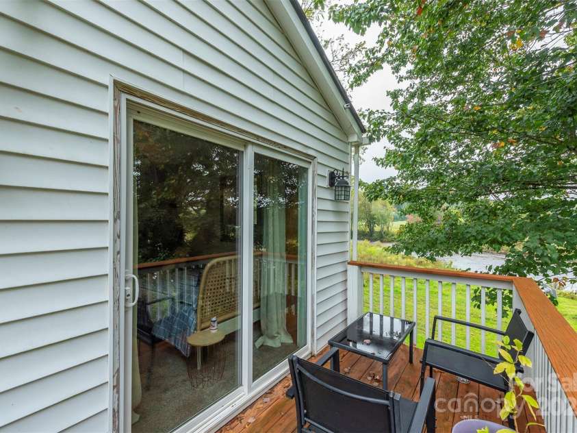 3755 Broad Street, Clyde, NC 28721.  MLS# CAR4308852, YatesRealty ID 2893. Balcony off back bedroom with river view
