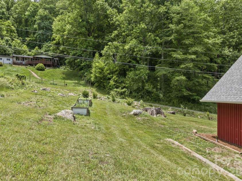 47 Fir Circle, Canton, NC 28716.  MLS# CAR4385612, YatesRealty ID 28936. Garden spaces and fruit trees