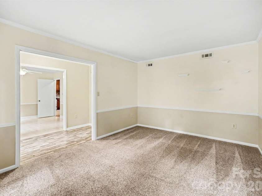 8644 Kirchenbaum Drive, Charlotte, NC 28210.  MLS# CAR4386953, YatesRealty ID 28937. First Floor features Crown Molding throughout
