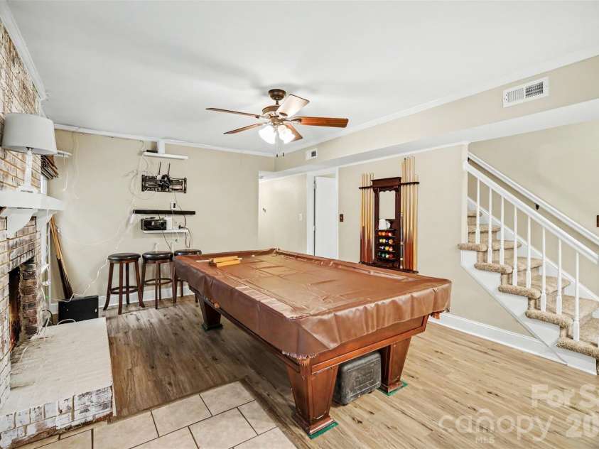 8644 Kirchenbaum Drive, Charlotte, NC 28210.  MLS# CAR4386953, YatesRealty ID 28937. Great Room Features Beautiful Brick Fireplace