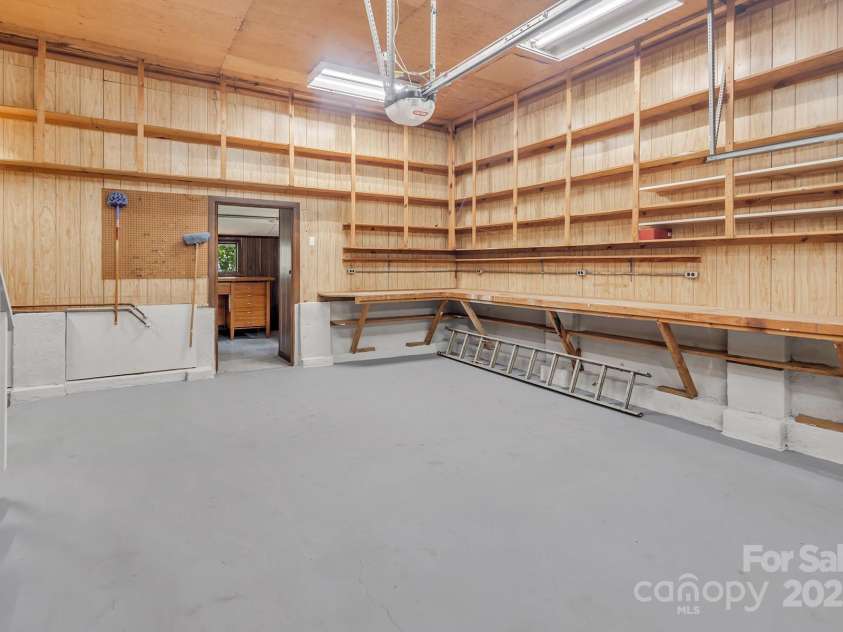 7608 Zermatt Lane, Charlotte, NC 28226.  MLS# CAR4283593, YatesRealty ID 28938. Two car garage w storage galore