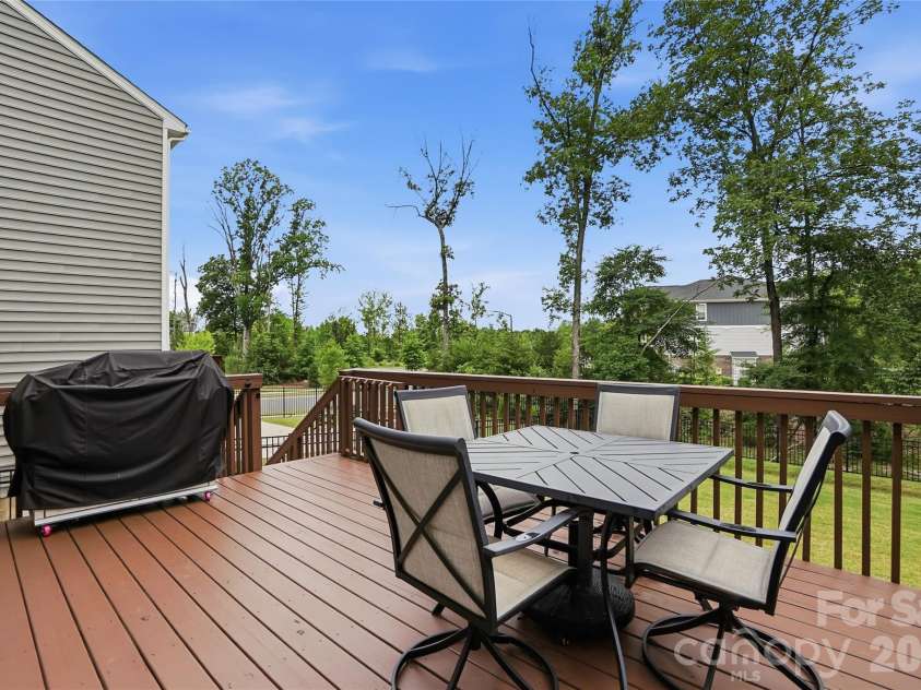 16009 Duval Drive, Charlotte, NC 28273.  MLS# CAR4387647, YatesRealty ID 28943. Deck off the kitchen space overlooking backyard