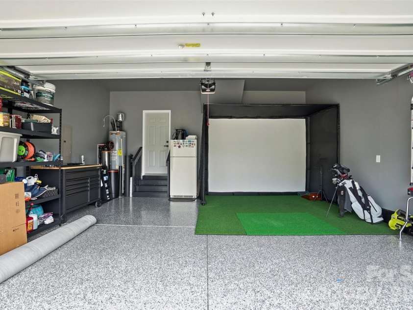 16009 Duval Drive, Charlotte, NC 28273.  MLS# CAR4387647, YatesRealty ID 28943. Garage finished with epoxy flooring and thughtful storage