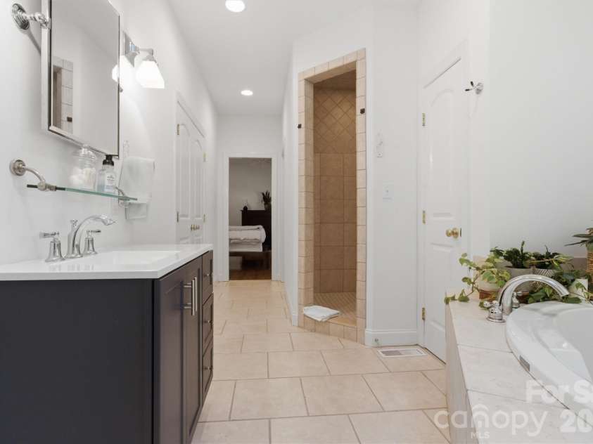 2925 Arbor Knoll, Concord, NC 28025.  MLS# CAR4380633, YatesRealty ID 28948. Custom tile shower in sizable primary bath
