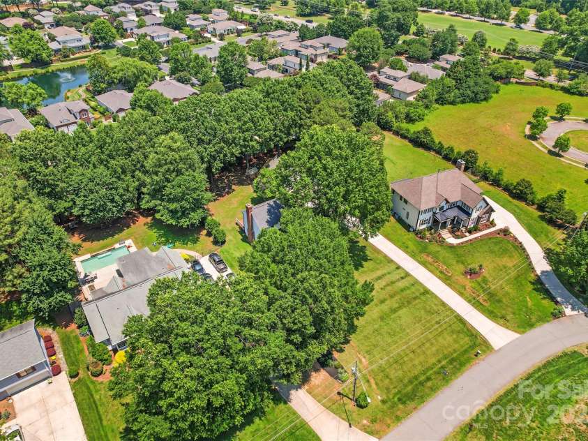 18733 Bluff Point Road, Cornelius, NC 28031.  MLS# CAR4267199, YatesRealty ID 28952. Aerial street view of Home on Bluff Point