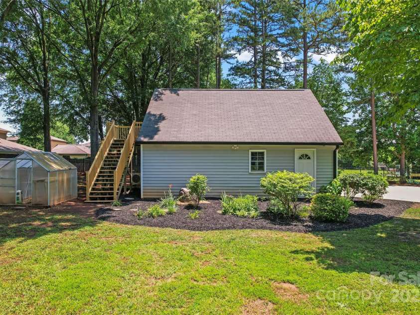 18733 Bluff Point Road, Cornelius, NC 28031.  MLS# CAR4267199, YatesRealty ID 28952. Detached garage with rear stairs leading to bonus room.
