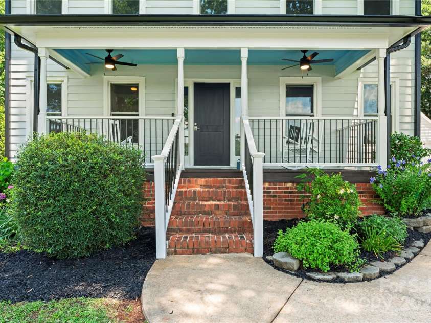 18733 Bluff Point Road, Cornelius, NC 28031.  MLS# CAR4267199, YatesRealty ID 28952. Enjoy front porch living w/year round water view