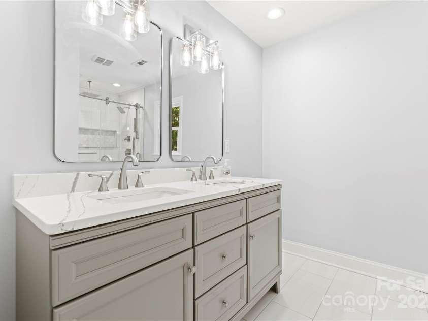 18733 Bluff Point Road, Cornelius, NC 28031.  MLS# CAR4267199, YatesRealty ID 28952. Recently remodeled Primary BA with dual vanity and tile floors