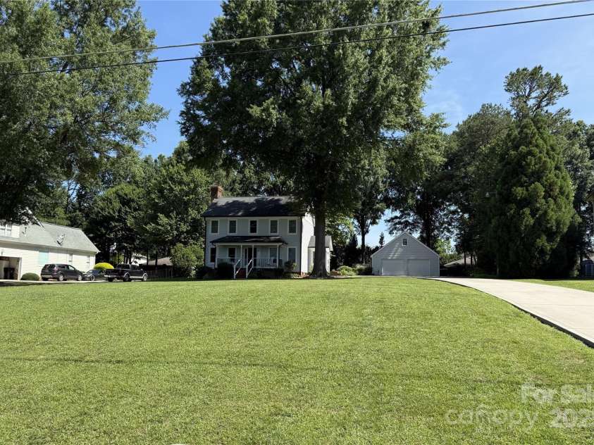 18733 Bluff Point Road, Cornelius, NC 28031.  MLS# CAR4267199, YatesRealty ID 28952. Streetscape on .59 acres