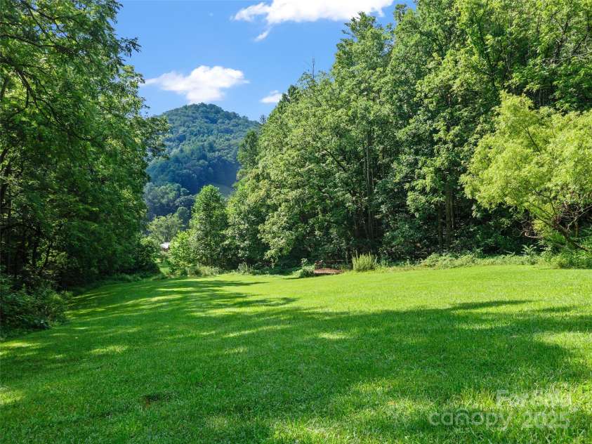 9065 NC 63 Highway, Leicester, NC 28748.  MLS# CAR4286038, YatesRealty ID 28957. Stage and Natural Amphitheater