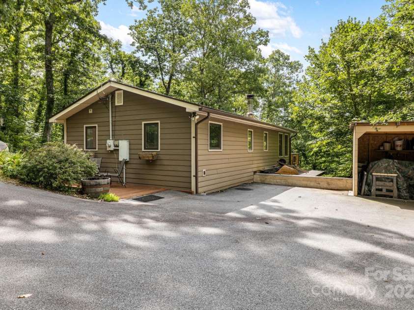 695 Huckleberry Mountain Road, Hendersonville, NC 28792.  MLS# CAR4281745, YatesRealty ID 28959. Driveway and shed