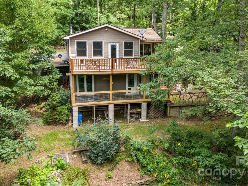 695 Huckleberry Mountain Road, Hendersonville, NC 28792.  MLS# CAR4281745, YatesRealty ID 28959. Upper/lower level decksTerraced yard