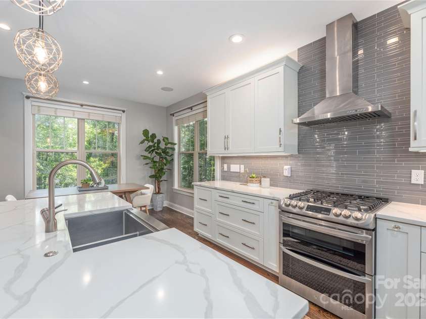 112 Mountain Drive, Biltmore Lake, NC 28715.  MLS# CAR4278930, YatesRealty ID 28972. Gas range with exhaust hood