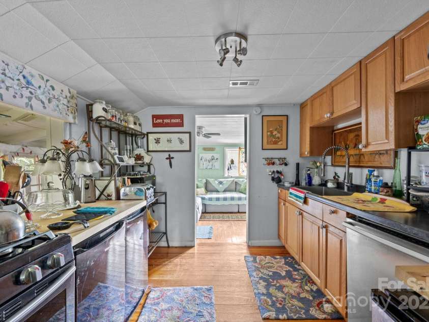 313 Chadwick Avenue, Hendersonville, NC 28792.  MLS# CAR4281374, YatesRealty ID 28973. Main House Kitchen (2 mini Fridges and 1 mini Freezer)