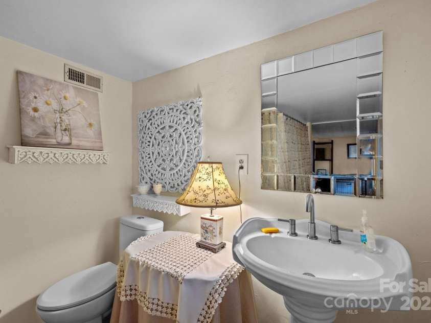 313 Chadwick Avenue, Hendersonville, NC 28792.  MLS# CAR4281374, YatesRealty ID 28973. Main House lower level bathroom