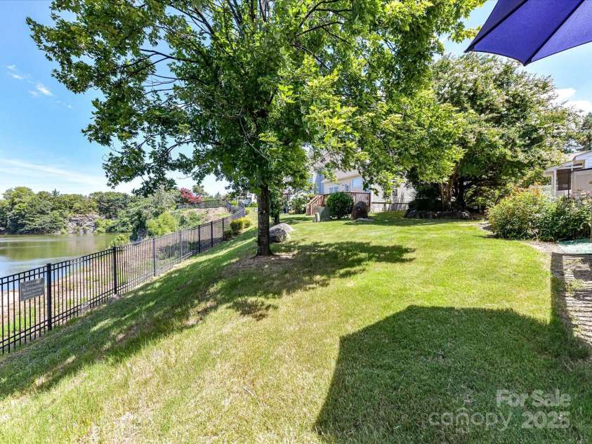 931 Par One Court, Fort Mill, SC 29715.  MLS# CAR4281118, YatesRealty ID 28977. Backyard/Quarry View