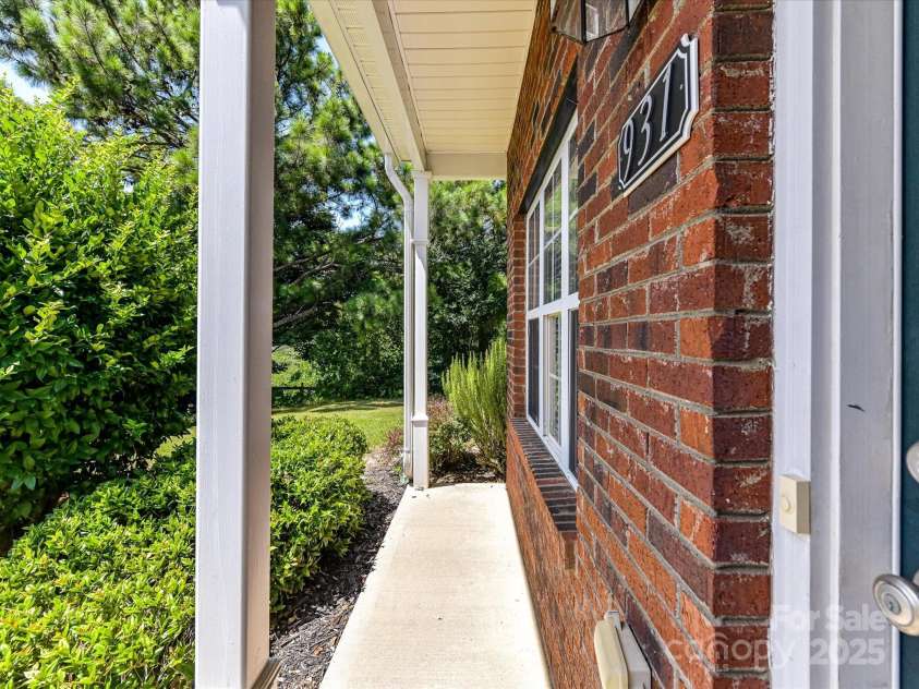 931 Par One Court, Fort Mill, SC 29715.  MLS# CAR4281118, YatesRealty ID 28977. Front Porch perfect for rocking chairs!