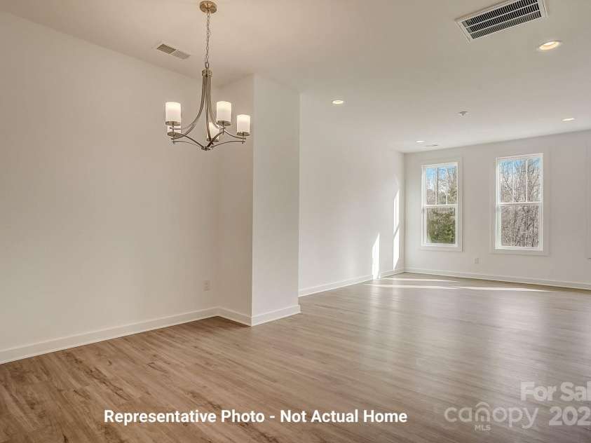 9923 Ansonborough Square, Huntersville, NC 28078.  MLS# CAR4284806, YatesRealty ID 28980. Dining to Living-Cambridge Plan