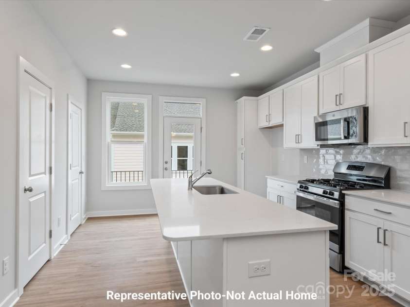 9927 Annsborough Square, Huntersville, NC 28078.  MLS# CAR4284657, YatesRealty ID 28981. Kitchen-door to rear patio-Berkshire Plan