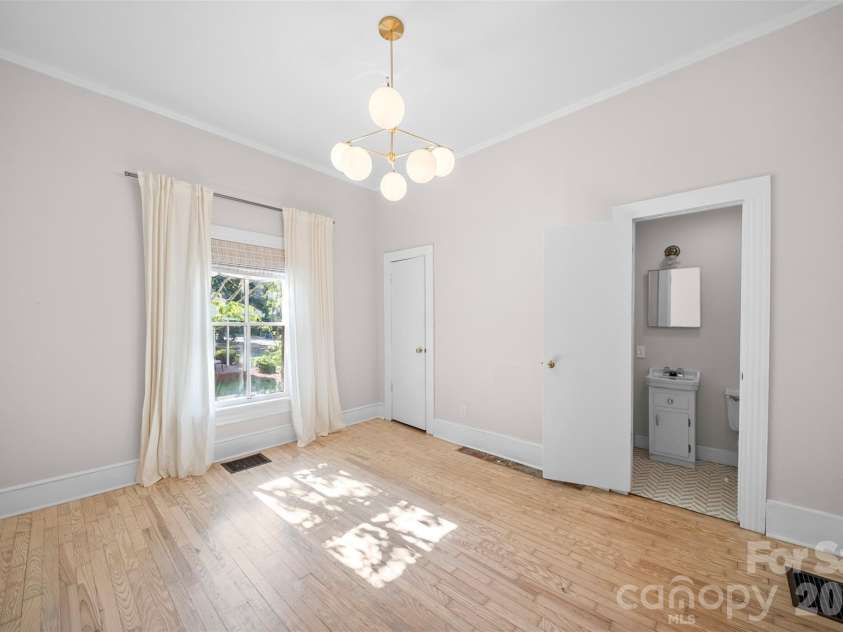 825 Montgomery Avenue, Albemarle, NC 28001.  MLS# CAR4391295, YatesRealty ID 28983. Bedroom with half bath