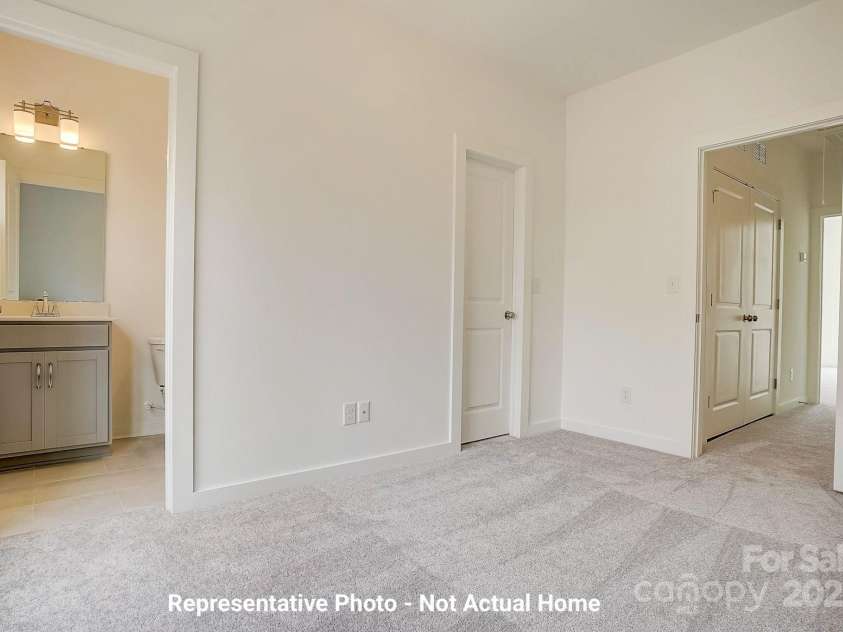9929 Ansonborough Square, Huntersville, NC 28078.  MLS# CAR4283931, YatesRealty ID 28983. Bedroom 2 with full bath and walk-in closet-Cambridge Plan