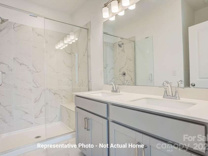 9929 Ansonborough Square, Huntersville, NC 28078.  MLS# CAR4283931, YatesRealty ID 28983. Main bath with tiled shower-Cambridge Plan