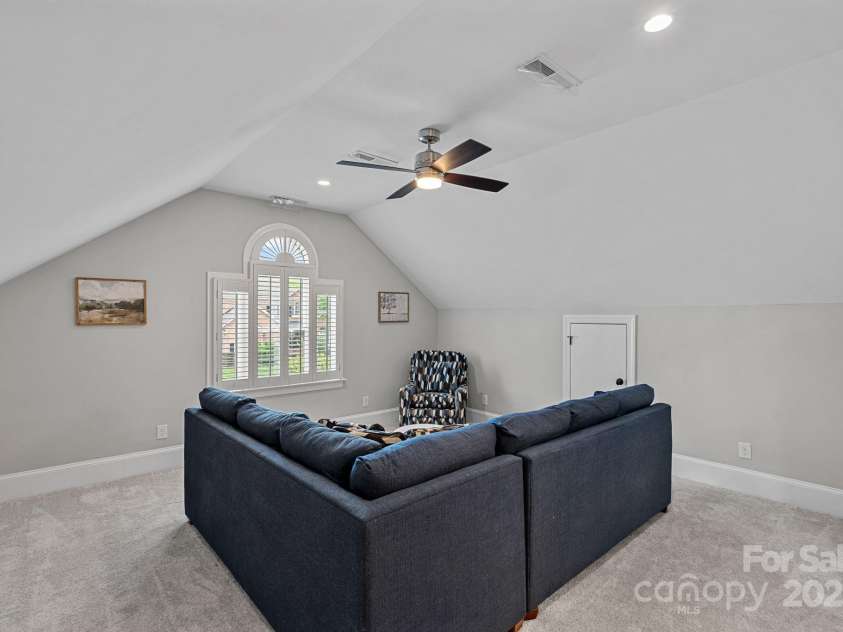 17308 Players Ridge Drive, Cornelius, NC 28031.  MLS# CAR4261359, YatesRealty ID 28986. The third bedroom/bonus room above the garage has no door, but does have an ensuite bath and ample storage.  Many uses for this space!