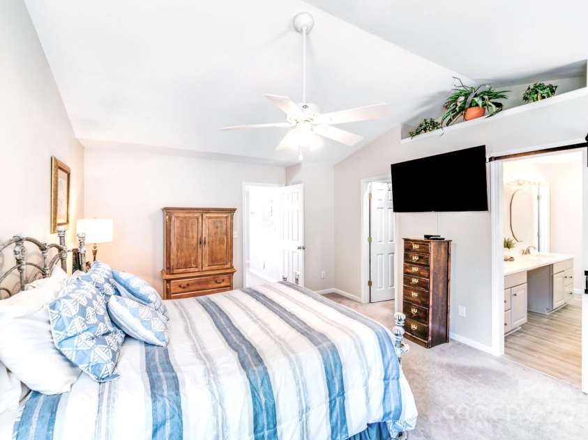 15811 Burlingame Drive, Huntersville, NC 28078.  MLS# CAR4269192, YatesRealty ID 28992. VIEW FROM BACK OF STE SHOWING WALK IN CLOSET AND FARM DOOR INTO YOUR OASIS  PRIMARY BATHROOM.